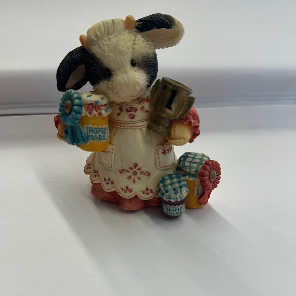 Charming Cow Figurine with Award Accents